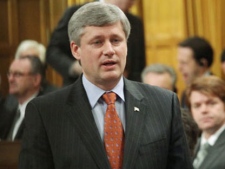 Prime Minister Stephen Harper stands in the House of Commons during Question Period, on Parliament Hill in Ottawa, Wednesday, April 14, 2010. (Fred Chartrand / THE CANADIAN PRESS)