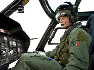 In this undated file photo made available by the Ministry of Defence in London, Friday April 30, 2010, Britain's of Prince Harry sits at the controls of a Squirrel helicopter of 660 Squadron at the Defence Helicopter Flying School at Shawbury, England. AP Photo/Ian Forshaw, Ministry of Defence, ho)