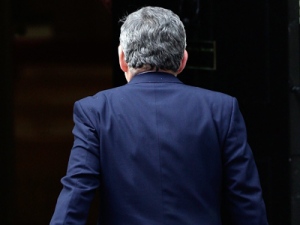 Britain's Prime Minister Gordon Brown returns to No.10 Downing Street after reading a statement to the media in London, Monday May 10, 2010, in which he said he intended to stand down as Labour Party leader. 