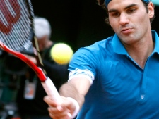 Switzerland's Roger Federer returns the ball to Colombia's Alejandro Falla during a second round match of the French Open tennis tournament at the Roland Garros stadium in Paris, Wednesday, May 26, 2010. (AP Photo/Laurent Rebours)