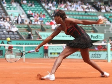 USA's Venus Williams returns the ball to Slovakia's Dominika Cibulkova during their third round match for the French Open tennis tournament at the Roland Garros stadium, Friday, May 28, 2010 in Paris. (AP Photo/Lionel Cironneau)