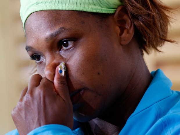 USA's Serena Williams reacts during her press conference after losing her quarterfinal match to Australia's Samantha Stosur for the French Open tennis tournament at the Roland Garros stadium in Paris, Wednesday June 2, 2010. (Christophe Ena/AP Photo)