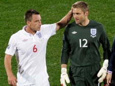 England's John Terry, left, speaks with England goalkeeper Robert Green, right, during the World Cup group C soccer match between England and the United States at Royal Bafokeng Stadium in Rustenburg, South Africa, on Saturday, June 12, 2010. (Michael Sohn/AP Photo)