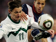 United States' Steve Cherundolo, right, competes for the ball Slovenia's Milivoje Novakovic, left, during the World Cup group C soccer match between Slovenia and the United States at Ellis Park Stadium in Johannesburg, South Africa, Friday, June 18, 2010. (AP Photo/Martin Meissner)