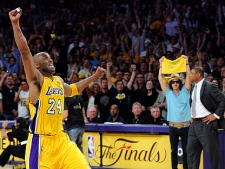 Los Angeles Lakers guard Kobe Bryant reacts as Boston Celtics coach Doc Rivers looks on as time runs out in Game 7 of the NBA basketball finals, Thursday, June 17, 2010, in Los Angeles. The Lakers won 83-79. (AP Photo/Mark J. Terrill)