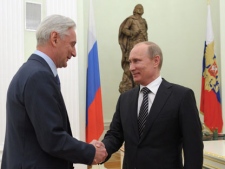 Russian President Vladimir Putin, right, shakes hands with Russian national ice hockey team coach Zinetula Bilyaletdinov during their meeting in the Kremlin in Moscow, Russia on Monday, May 21, 2012. Russia won the ice hockey world championship Sunday by defeating Slovakia 6-2 in the final. (AP Photo/RIA-Novosti, Alexei Druzhinin, Government Press Service)