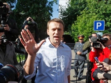 Opposition leader Alexei Navalny speaks to his supporters and media after his release from a detention centre in Moscow on Thursday, May 24, 2012. Navalny had served a 15-day sentence on charges of disobeying police. (AP Photo/Mikhail Metzel)