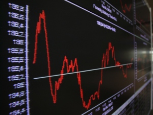 A man passes an array of displays at the Stock Exchange in Athens on Friday, May 25, 2012. Uncertainty over Greece's future in the eurozone has hammered markets ahead of June 17 general elections in the crisis-hit country. The Greek share index touched new 22-year lows, dipping below 500 points. (AP Photo/Thanassis Stavrakis)