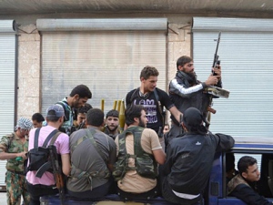 This citizen journalism image provided by Edlib News Network ENN purports to show Syrian rebels in the northern town of Kfar Nebel, Syria on Tuesday, June 5, 2012. (AP Photo/Edlib News Network ENN)