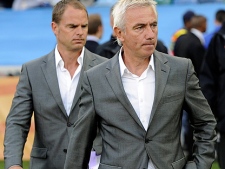 Netherlands head coach Bert van Marwijk, foreground, arrives on the pitch for the World Cup round of 16 soccer match between the Netherlands and Slovakia at the stadium in Durban, South Africa, Monday, June 28, 2010. (AP Photo/Martin Meissner)