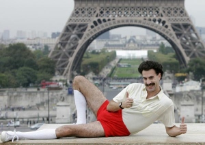 Sacha Baron Cohen, dressed in his character "Borat" poses for the press near the Eiffel tower in Paris, in this, Oct. 9, 2006, file photo. (AP / Christophe Ena, file)