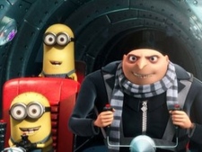 In this film publicity file image released by Universal Pictures, Gru, voiced by Steve Carell, is shown with two of his minions in a scene from the 3-D CGI feature, 'Despicable Me', about a villain who meets his match in three little girls. (AP Photo/Universal Pictures - Illumination Entertainment, File)