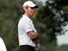 Mike Weir massages his right elbow after teeing off on the 11th tee during Pro-Am day at the Canadian Open golf tournament at St. George's Golf and Country Club in Toronto Wednesday July 21, 2010. (THE CANADIAN PRESS/Darren Calabrese)