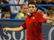 Gilles Simon, of France, prepares to hit a return to Andy Roddick, of the United States, during the Legg Mason Tennis Classic in Washington on Thursday, Aug. 5, 2010. (AP Photo/Jacquelyn Martin)