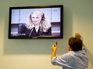 Actress Mia Farrow  is seen on a screen in the pressroom of the U.N.-backed Special Court for Sierra Leone in Leidschendam, Netherlands, Monday, Aug. 9, 2010.(AP Photo/Robert Vos, Pool)