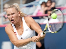 Caroline Wozniacki  from Denmark returns to Svetlana Kuznetsova from Russia during semi-final play at the Rogers Cup tennis tournament Monday, August 23, 2010 in Montreal. Wozniacki won 6-2, 6-3 to move on to the final later in the day. (THE CANADIAN PRESS/Paul Chiasson)