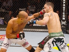 B.J. Penn (left) connects with Frankie Edgar in their battle for the lightweight title at UFC 112 on April 10, 2010, in Abu Dhabi, U.A.E. The UFC's lightweight landscape should become a lot clearer Saturday night at UFC 118 in Boston. (THE CANADIAN PRESS/HO- UFC - Josh Hedges)