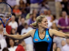 Kim Clijsters, of Belgium, launches a ball into the stands after defeating Sally Peers, of Australia, 6-2, 6-1 at the U.S. Open tennis tournament in New York, Wednesday, Sept. 1, 2010. (AP Photo/Charles Krupa)