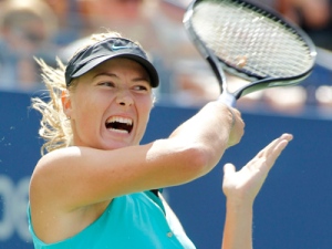 Maria Sharapova  of Russia returns the ball to Beatrice Capra of the United States at the U.S. Open tennis tournament in New York, Saturday, Sept. 4, 2010. (AP Photo/Paul J. Bereswill)