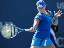 Kim Clijsters  of Belgium returns the ball to Ana Ivanovic of Serbia at the U.S. Open tennis tournament in New York, Sunday, Sept. 5, 2010. (AP Photo/Kathy Willens)