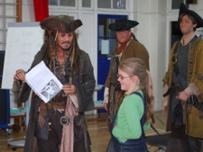 In this Handout image made available by Meridian School on Friday, Oct. 8, 2010, U.S. actor Johnny Depp, left, holds a letter from 5 year old Bea Delap, right, inviting him to attend her school assembly.